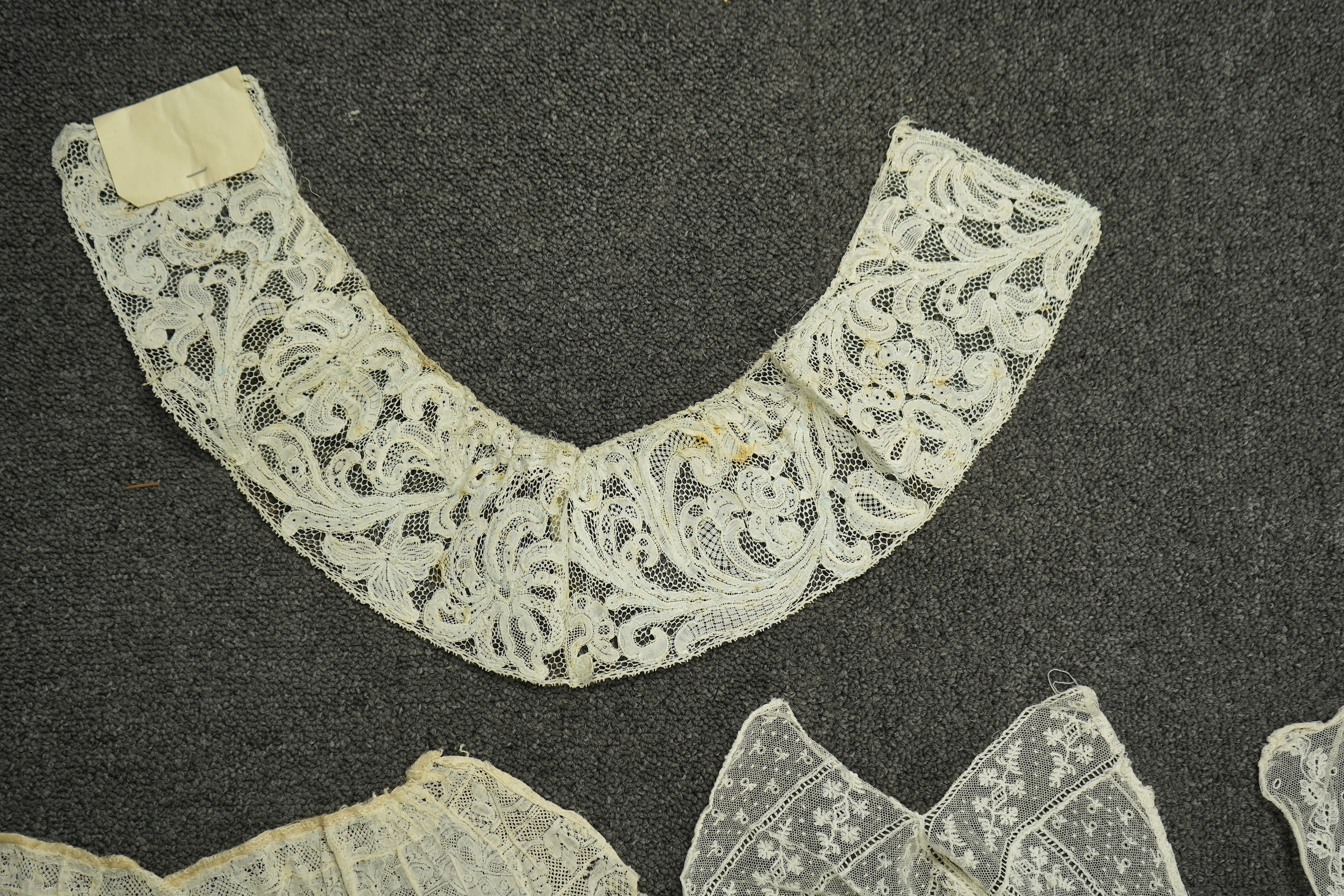 Various lengths of 18th and 19th century lace trimming and two needle run bonnets. Including a collar made from two rows of 18th century Valenciennes lace, a length Valenciennes lace, a shorter length of Pointe de Anglet